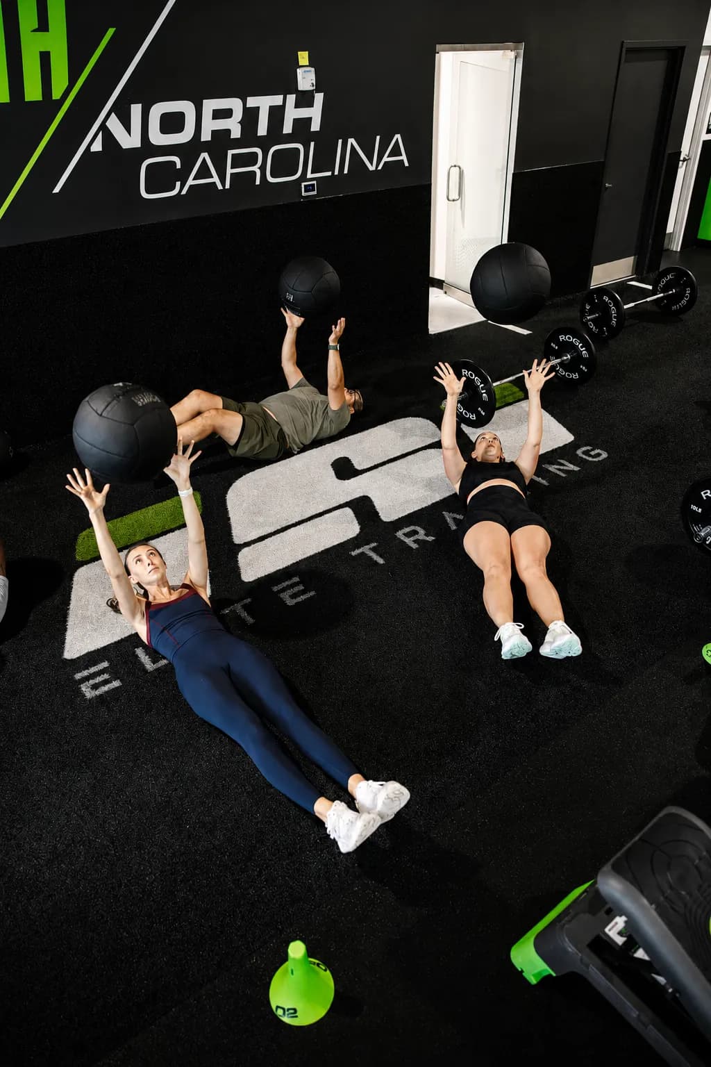 ISI Elite Training members completing a medicine ball workout together