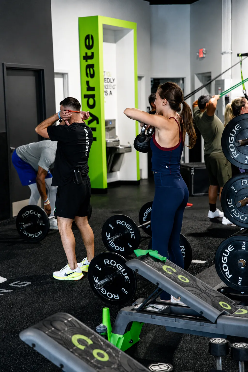 An ISI coach and member moving through a group workout
