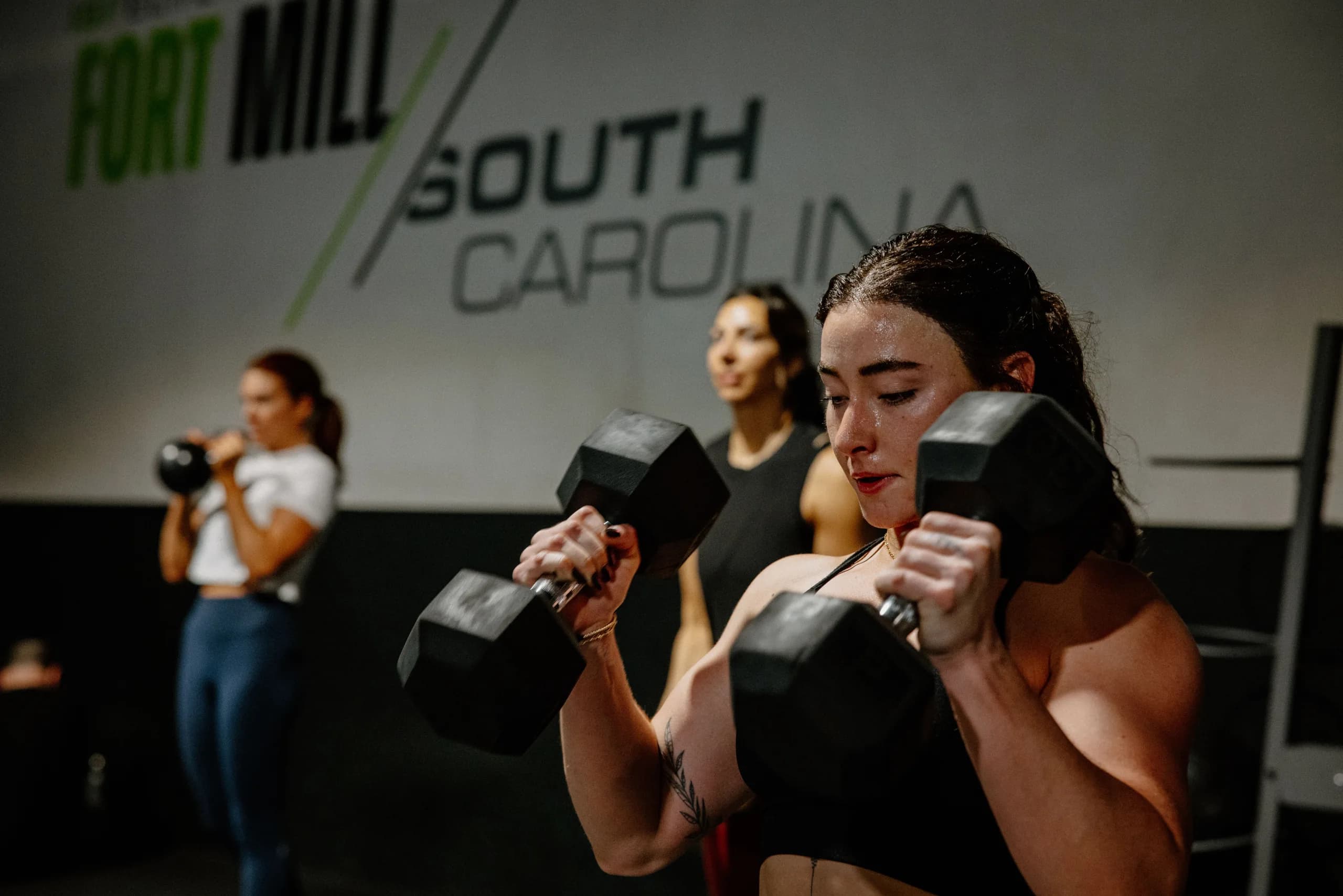 ISI Elite Training members completing a dumbbell workout